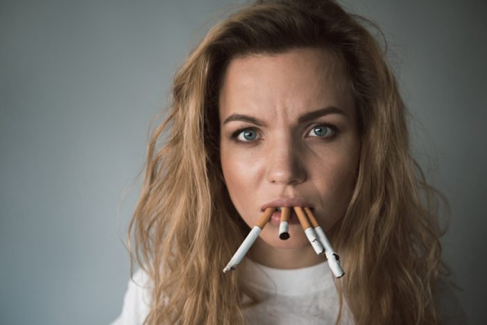 miserable woman smoking