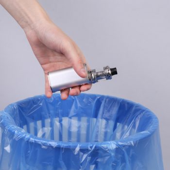 vape being thrown in a bin